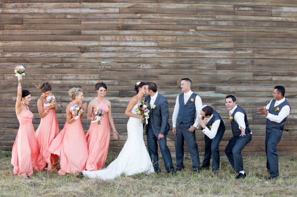 a bride and groom and their wedding party having a fun moment creating photographs Lake Tinaroo Wedding Photography, Yunguburra wedding photography, Atherton Tablelands wedding photography, Nathan David Kelly Cairns Wedding Photography, Cairns Wedding Photographer, Palm Cove Wedding Photography